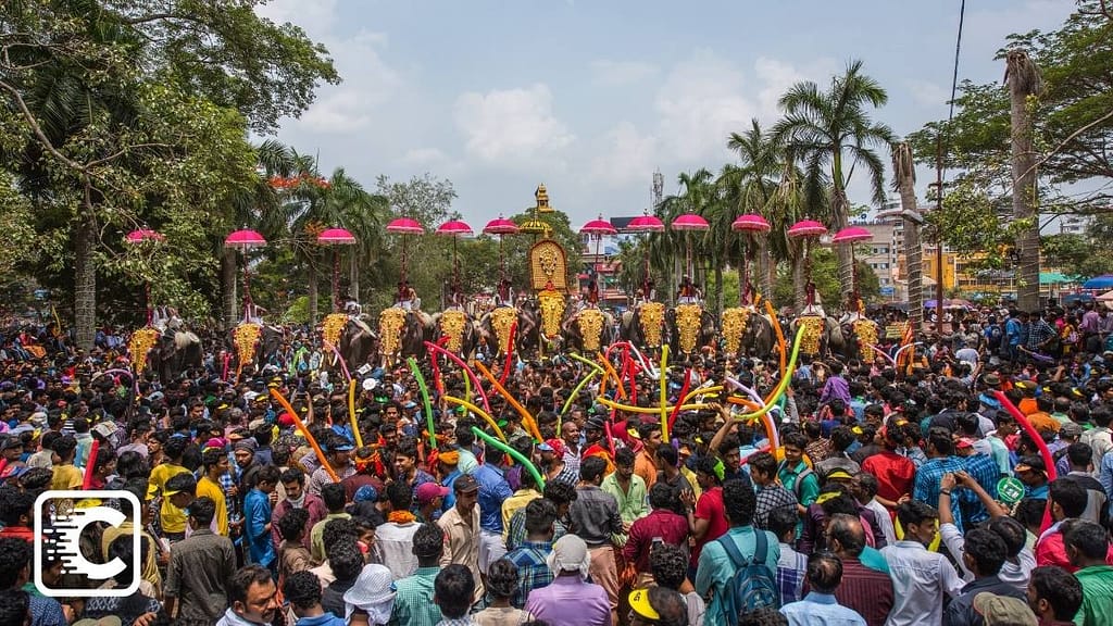 Crowds assemble for a festival at a Hindu temple